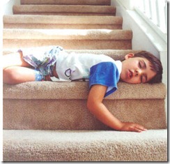 child-asleep-on-stairs