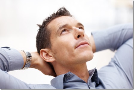 Handsome young man lost in deep thought