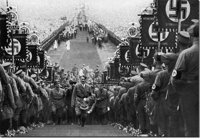 hitler-walking-up-steps-at-nazi-rally